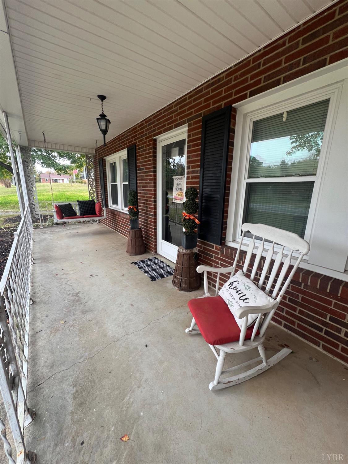 1573 Grit Road Hurt, VA 24563 - Photo 3 of 31 a view of a patio with a table and chairs