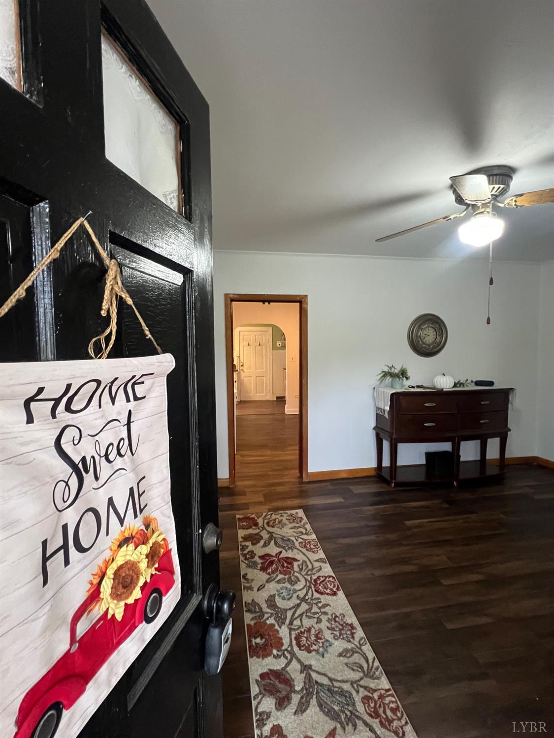 1573 Grit Road Hurt, VA 24563 - Photo 4 of 31 a bedroom with a bed and a lamp on dresser