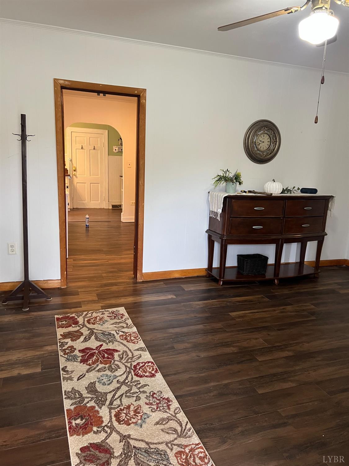 1573 Grit Road Hurt, VA 24563 - Photo 5 of 31 a view of a hallway with wooden floor and a chandelier