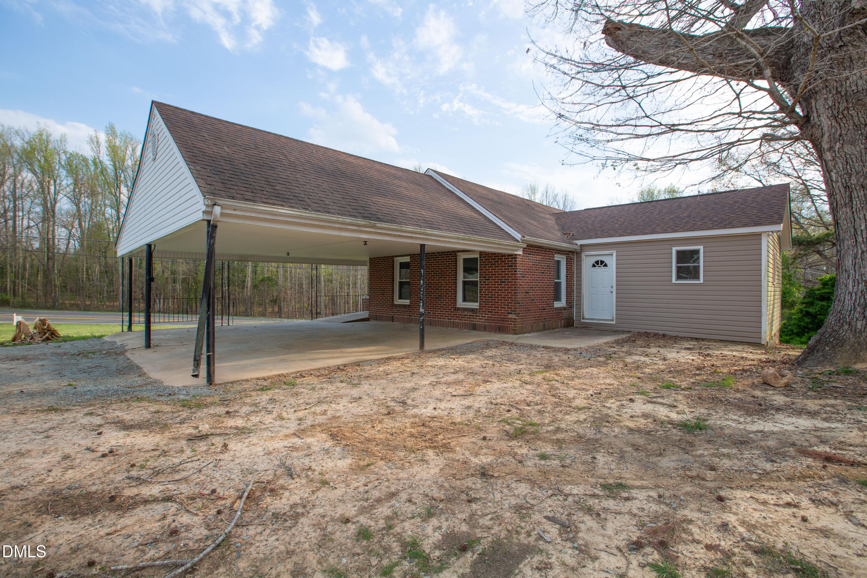 4295 Virgilina Road Roxboro, NC 27574 - Photo 32 of 46 a view of a house with a backyard