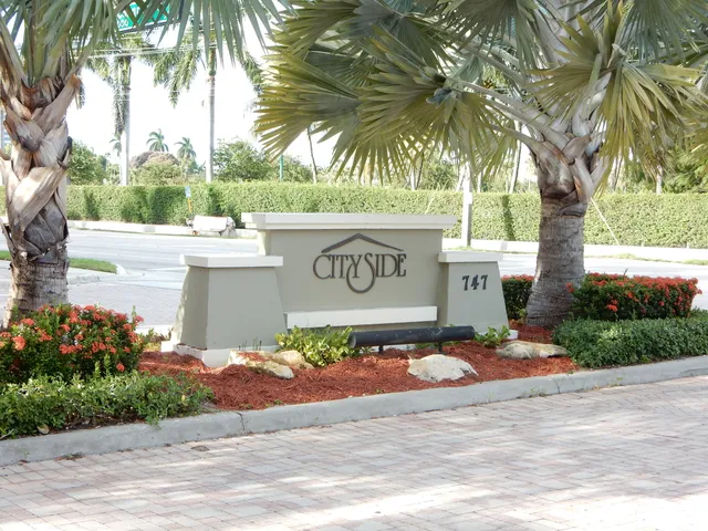 a sign that is on the side of a road