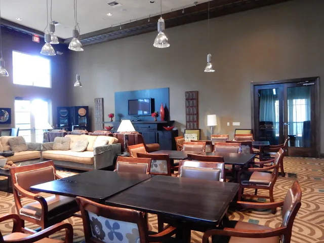 a lobby with furniture and window