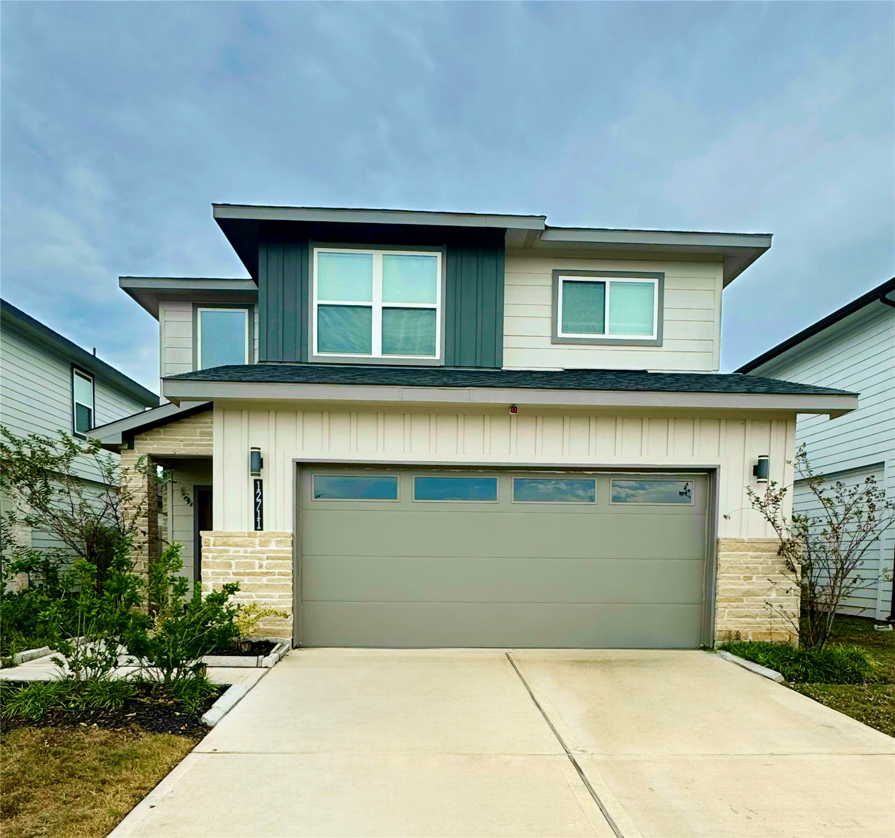 a front view of a house with garden