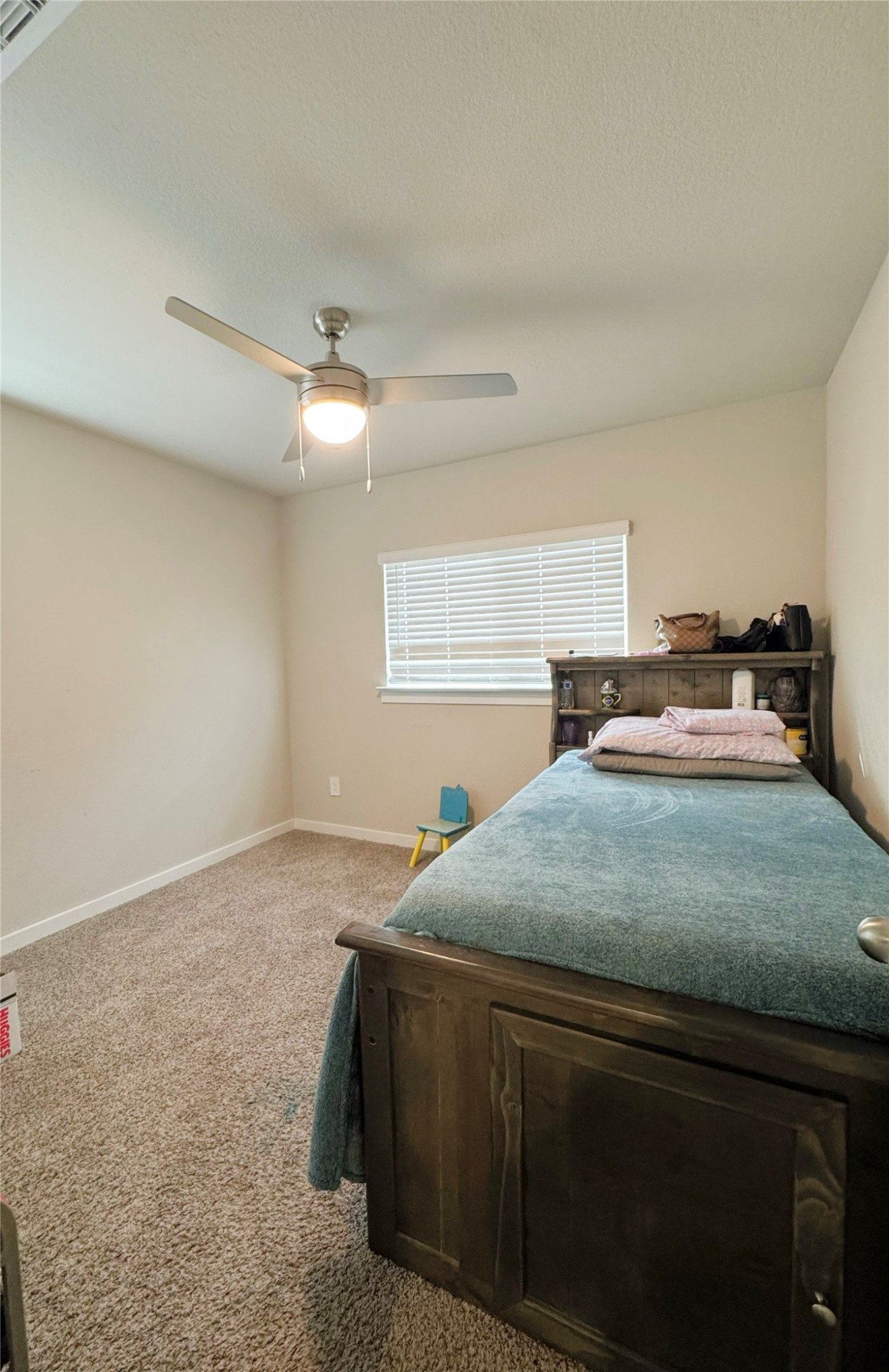 12711 Basinghall Lane Houston, TX 77047 - Photo 20 of 25 a bedroom with a bed and window