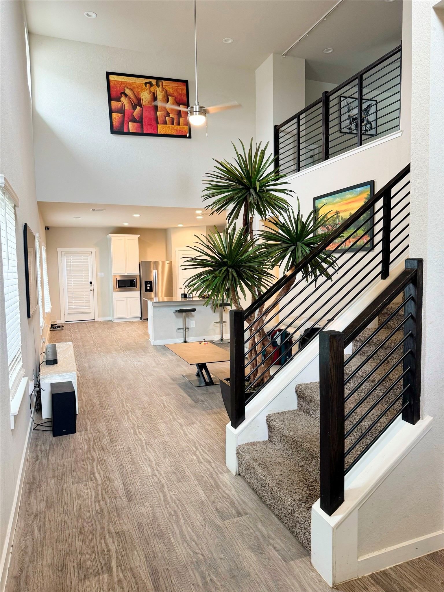 12711 Basinghall Lane Houston, TX 77047 - Photo 6 of 25 a hallway with a couch and chandelier