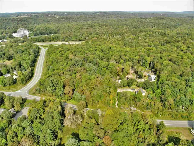 a view of a big yard with green space