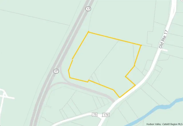 a view of a swimming pool with a yard