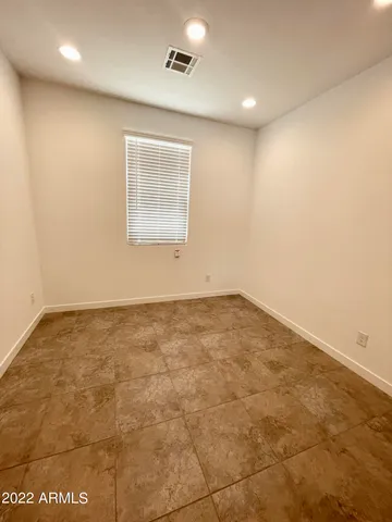 a view of a kitchen with a sink and a refrigerator