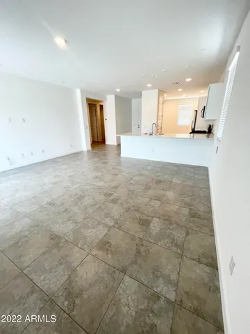 a view of a kitchen with a sink and cabinets