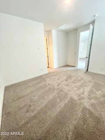 an empty room with a windows