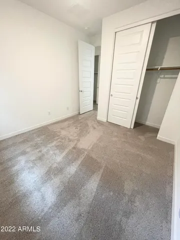 a view of a hallway view with staircase