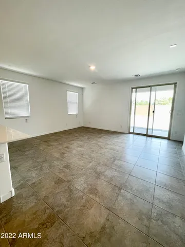 a view of a hallway to the room