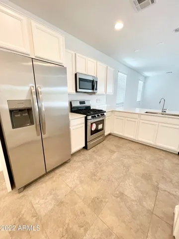 a view of a hallway to rooms