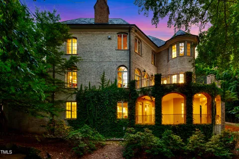 a front view of a house with lots of green space