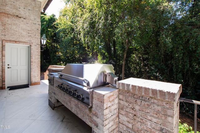 a dining room with furniture a chandelier and wooden floor