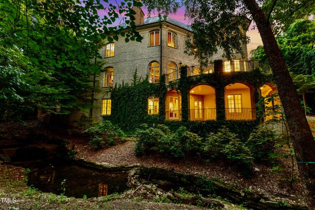 a view of entrance of the house with a yard