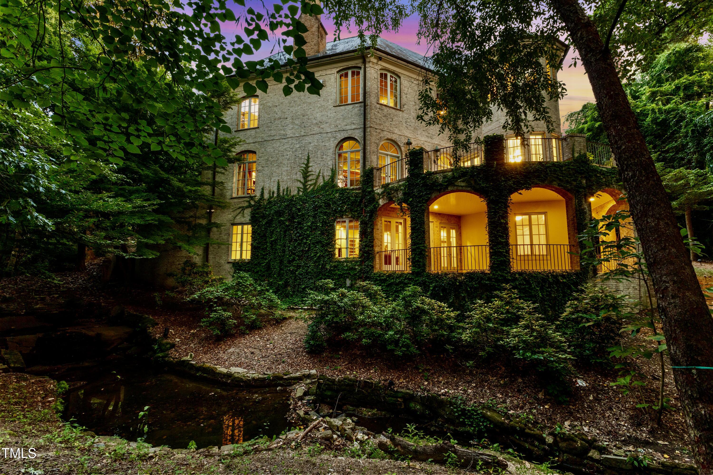 2658 Davis Street Raleigh, NC 27608 - Photo 4 of 99 a front view of a house with garden