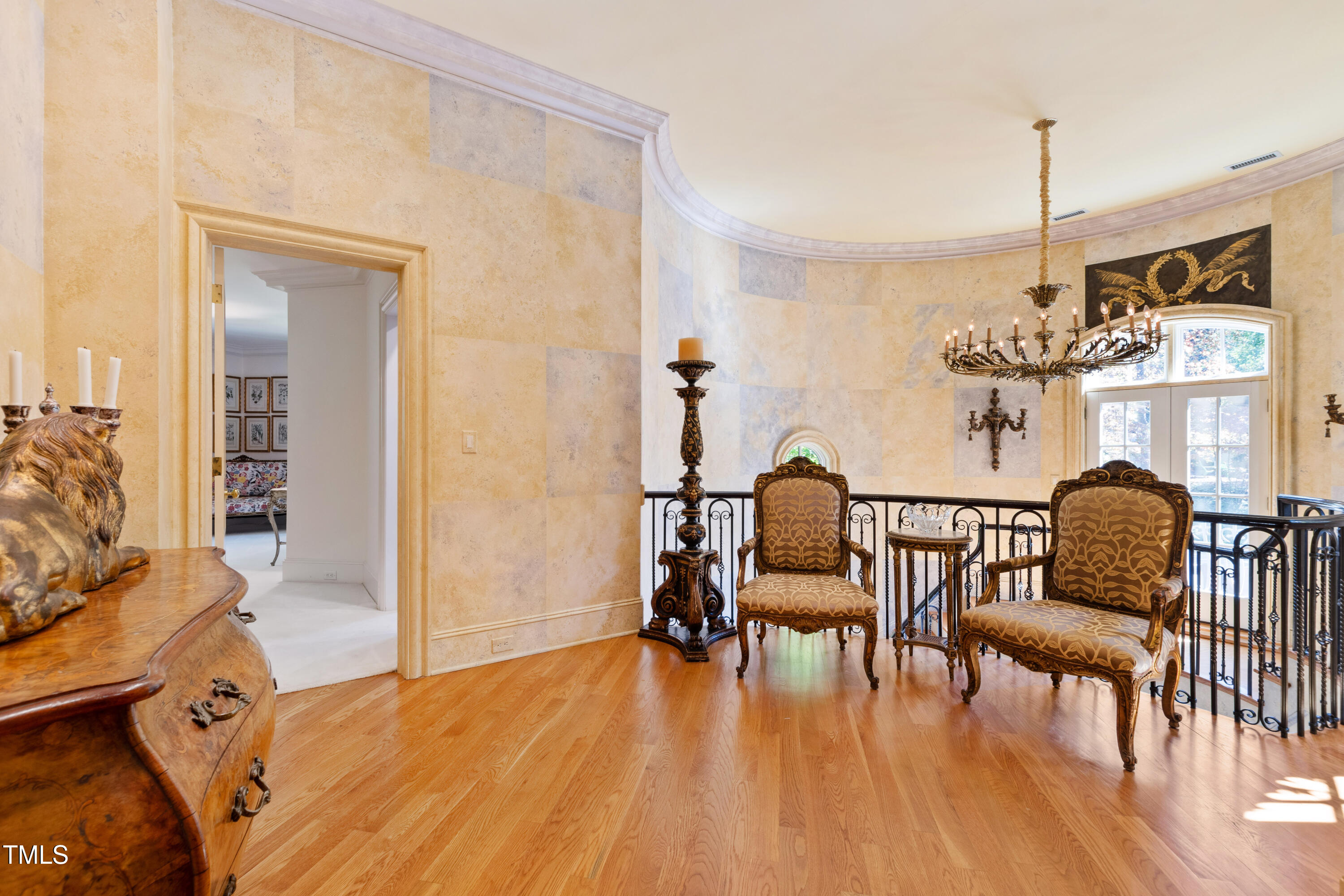 2658 Davis Street Raleigh, NC 27608 - Photo 49 of 99 a dining room with furniture a chandelier and wooden floor