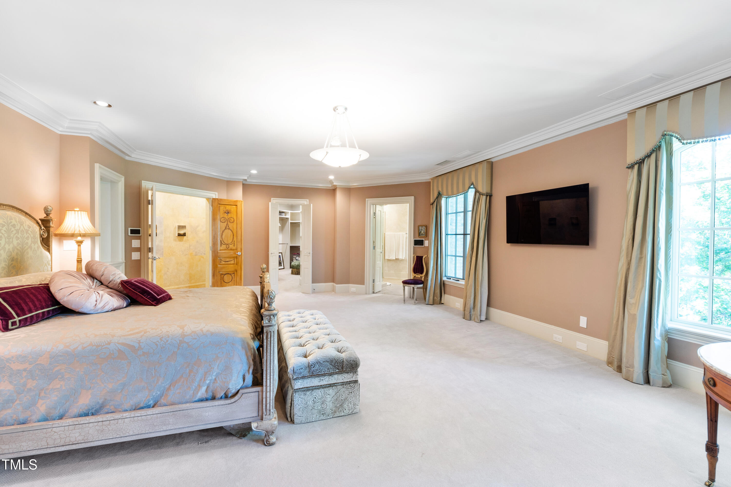 2658 Davis Street Raleigh, NC 27608 - Photo 57 of 99 a bedroom with a bed and large windows