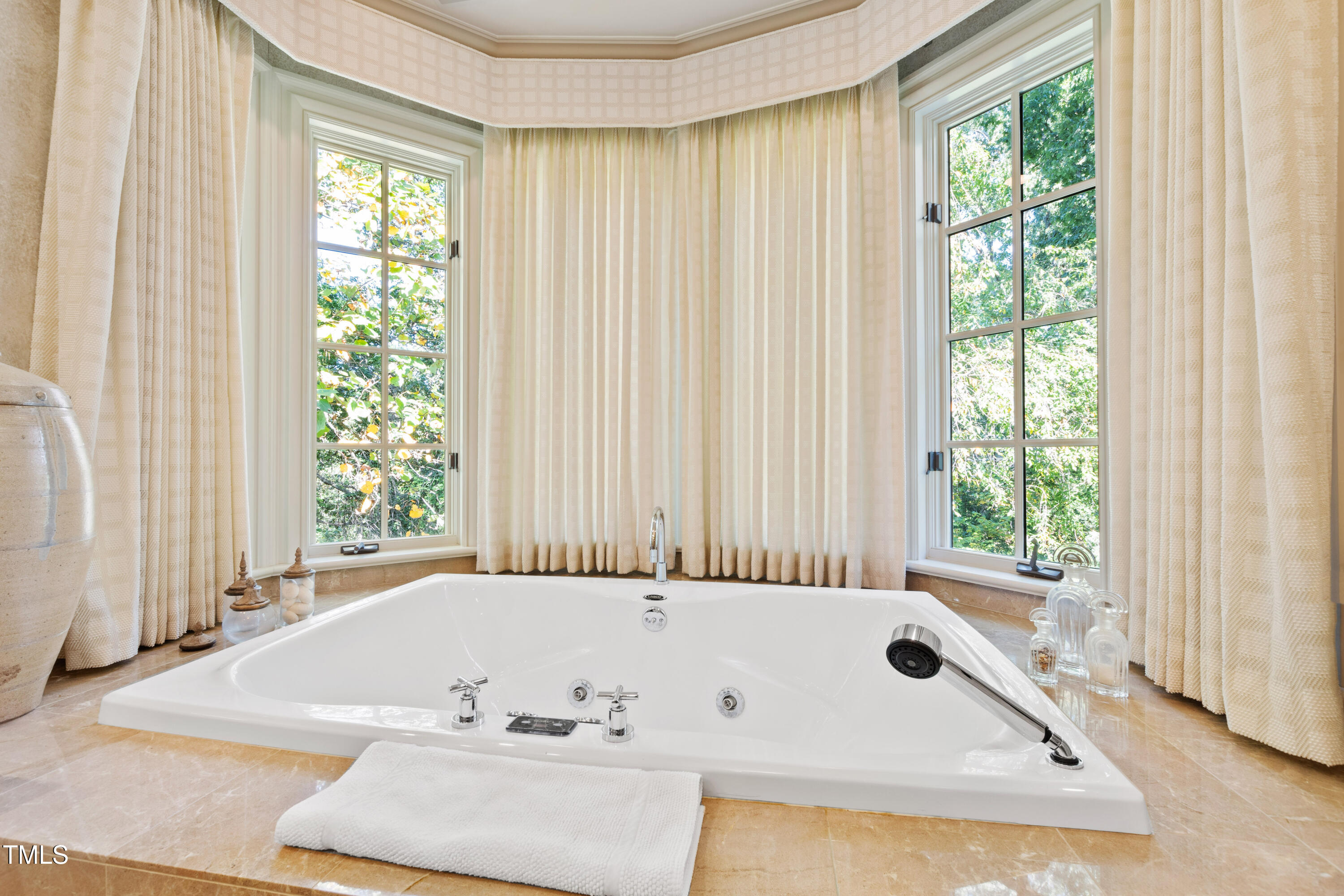 2658 Davis Street Raleigh, NC 27608 - Photo 59 of 99 a bath tub sitting in a bathroom next to a window