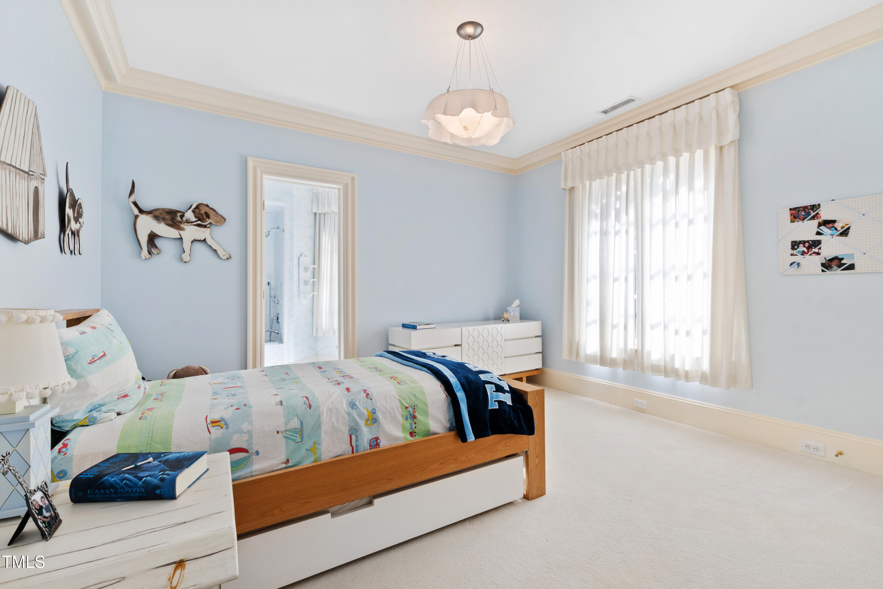 2658 Davis Street Raleigh, NC 27608 - Photo 62 of 99 a bedroom with a bed and a window