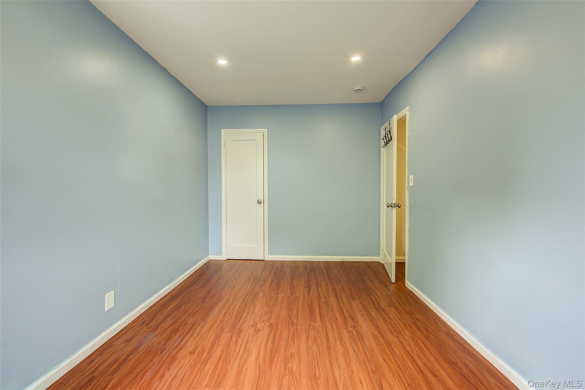 164-38 76th Road Queens, NY 11366 - Photo 24 of 44 a view of a big room with wooden floor