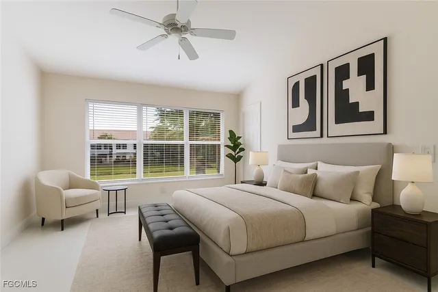 a bedroom with a bed and a large window