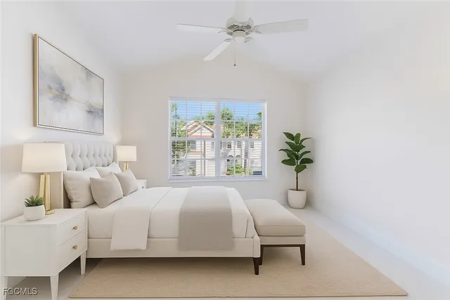 a bedroom with a large bed and a window