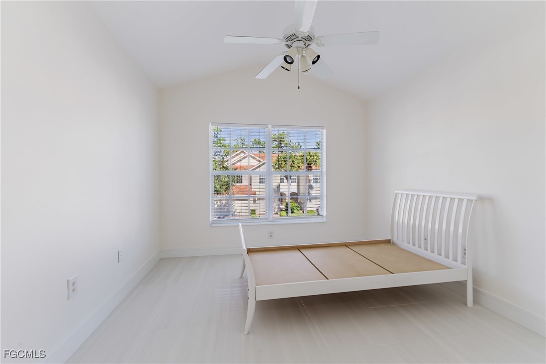827 Hampton Circle, Unit 146 Naples, FL 34105 - Photo 27 of 36 an empty room with a window