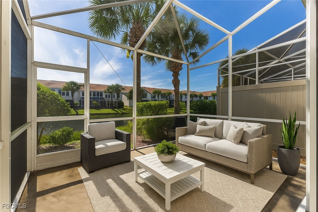 827 Hampton Circle, Unit 146 Naples, FL 34105 - Photo 31 of 36 a balcony with furniture and a potted plant