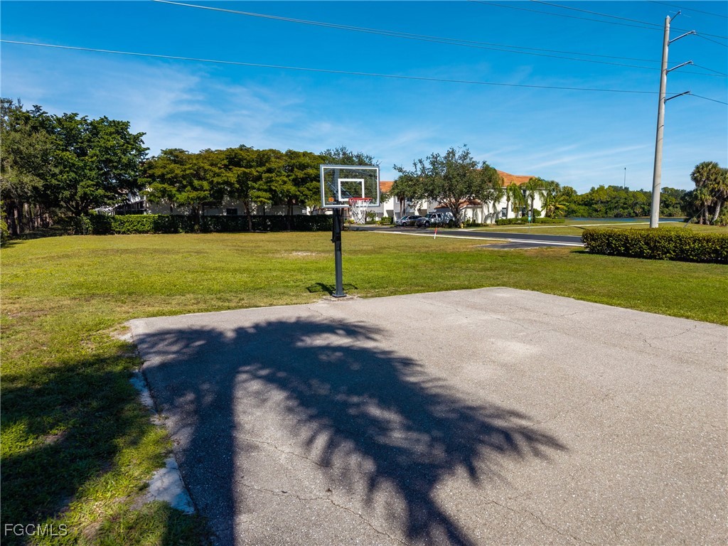 827 Hampton Circle, Unit 146 Naples, FL 34105 - Photo 34 of 36 a view of an outdoor space and a lake view
