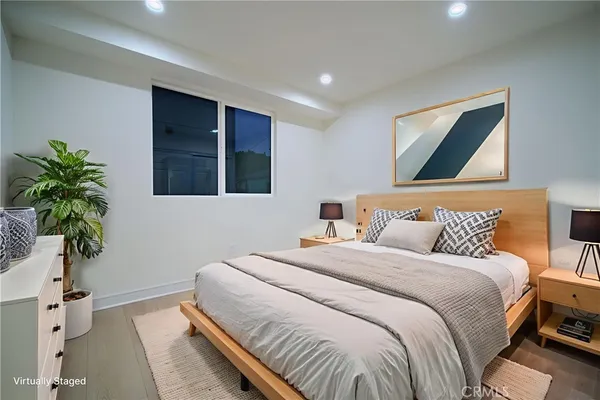 a bathroom with a toilet a sink and shower