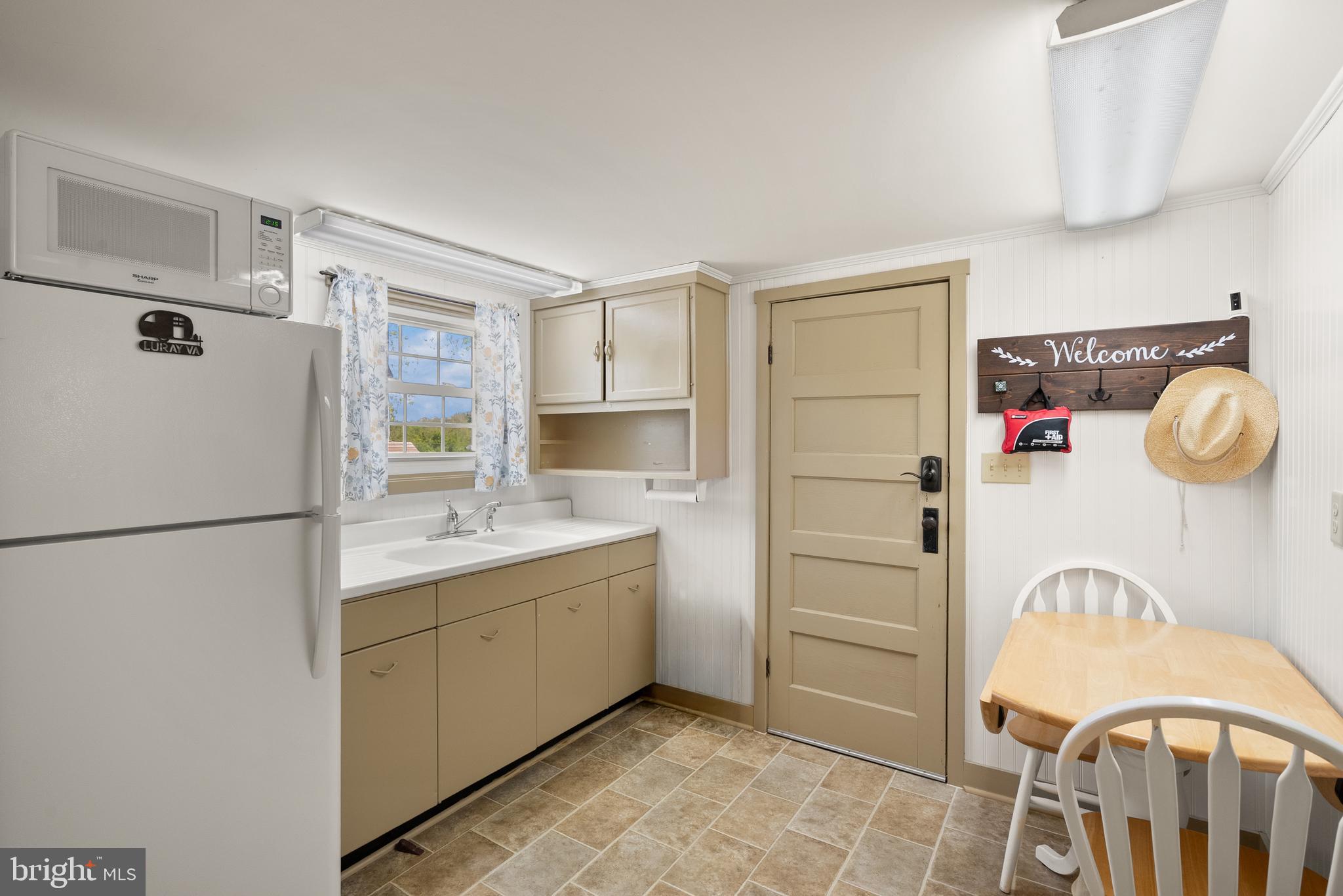 1449 Egypt Bend Road Luray, VA 22835 - Photo 31 of 48 a kitchen with a refrigerator a sink and dishwasher