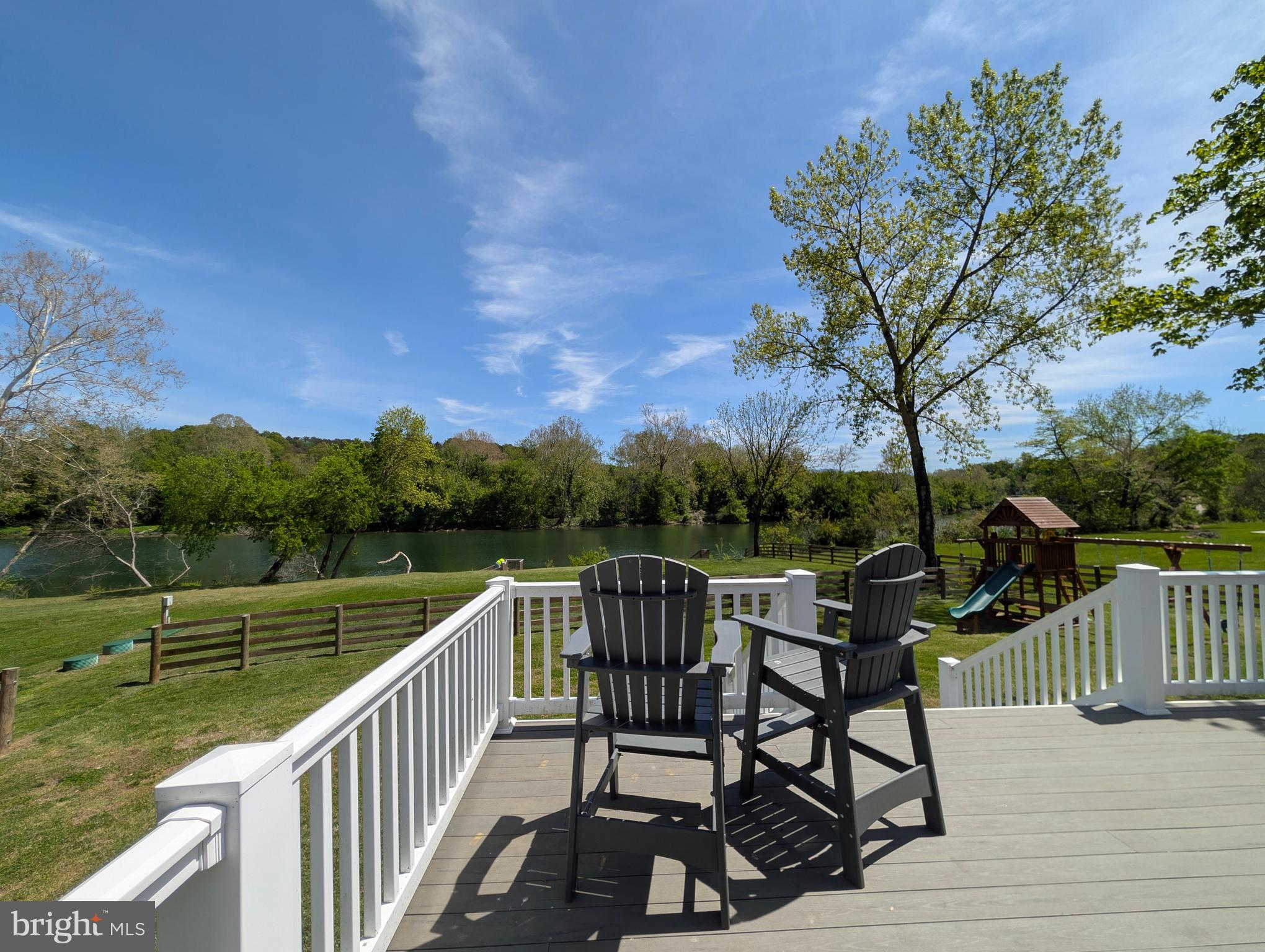 1449 Egypt Bend Road Luray, VA 22835 - Photo 45 of 48 a view of a lake with table and chairs next to a yard