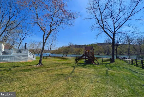 a view of swimming pool with a yard