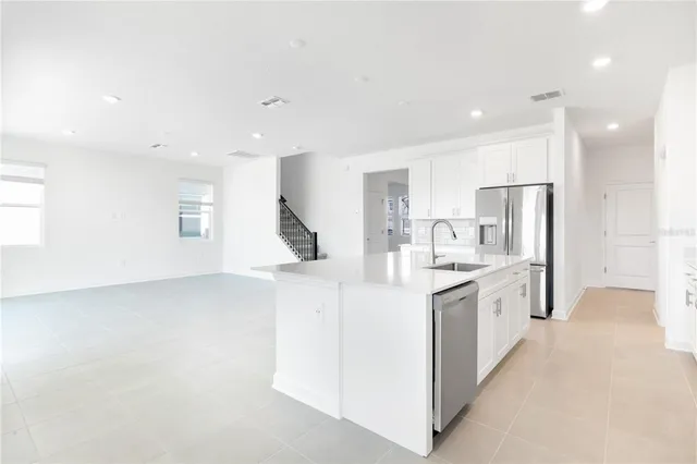 a view of an empty walk in closet with empty racks