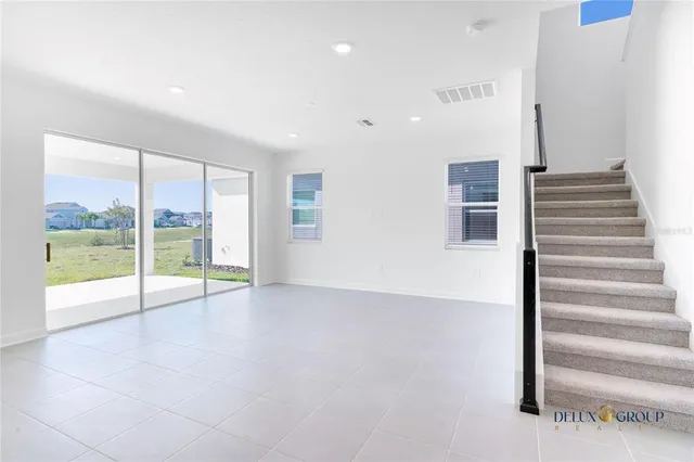 a view of an entryway with wooden floor