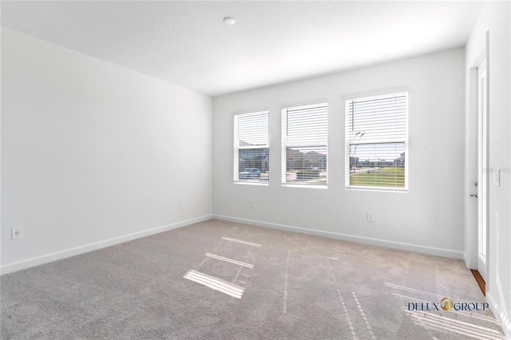 2947 Believe In Yourself Court Clermont, FL 34714 - Photo 24 of 50 an empty room with windows