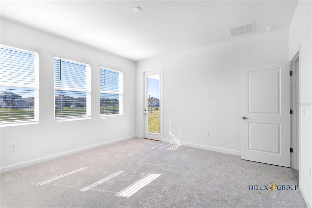 2947 Believe In Yourself Court Clermont, FL 34714 - Photo 25 of 50 a view of an empty room with a window