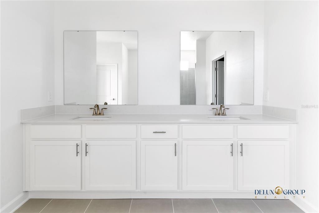 2947 Believe In Yourself Court Clermont, FL 34714 - Photo 29 of 50 a bathroom with a sink and a mirror