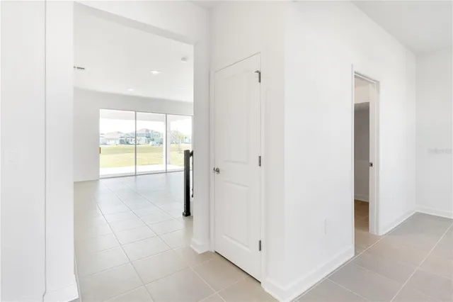 a view of an empty room and a window