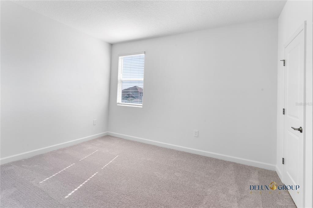 2947 Believe In Yourself Court Clermont, FL 34714 - Photo 44 of 50 an empty room with windows