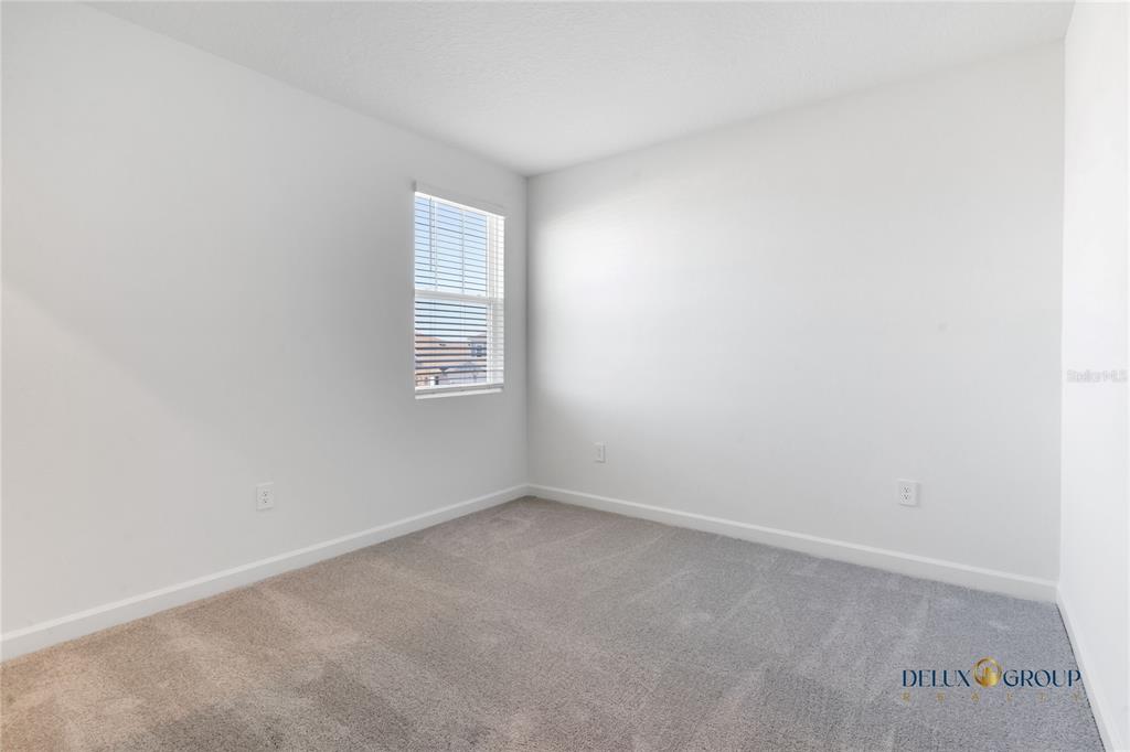 2947 Believe In Yourself Court Clermont, FL 34714 - Photo 46 of 50 a view of an empty room with a window