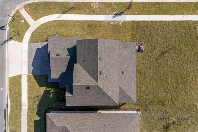 an aerial view of residential house with an outdoor space