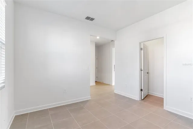 a white toilet sitting next to a white sink