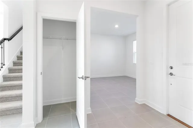 a kitchen with stainless steel appliances kitchen island sink refrigerator and cabinets