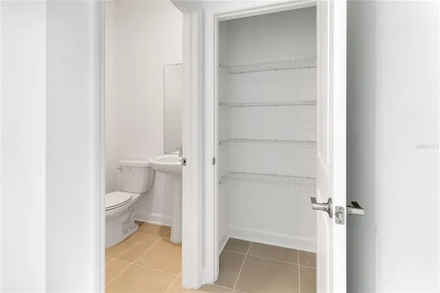 a kitchen with stainless steel appliances a refrigerator sink stove microwave and cabinets