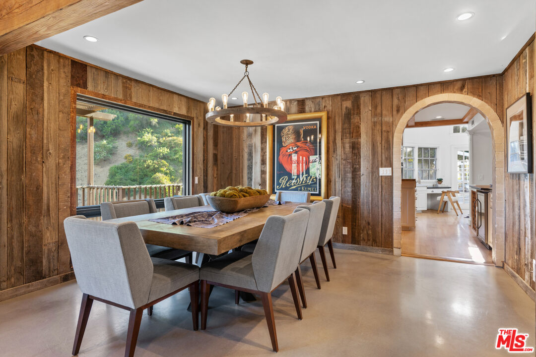 3371 Mandeville Canyon Road Los Angeles, CA 90049 - Photo 11 of 44 a view of a dining room with furniture window and outside view