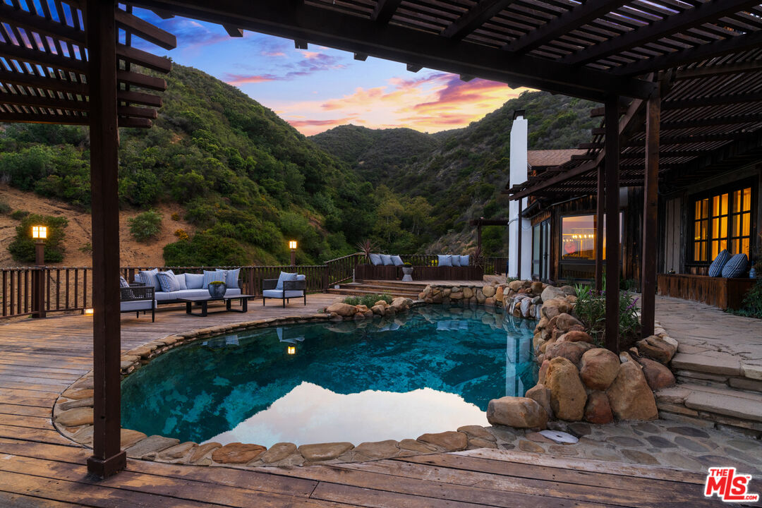 3371 Mandeville Canyon Road Los Angeles, CA 90049 - Photo 43 of 44 a view of swimming pool and patio