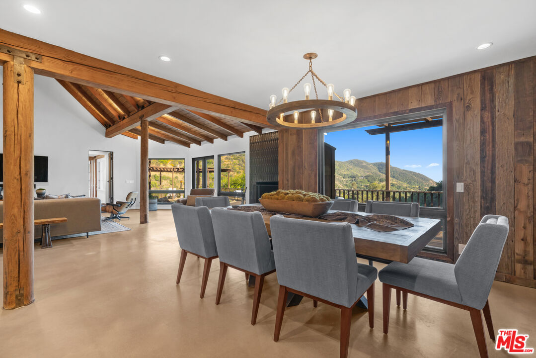 3371 Mandeville Canyon Road Los Angeles, CA 90049 - Photo 10 of 44 a view of a dining room with furniture window and outside view